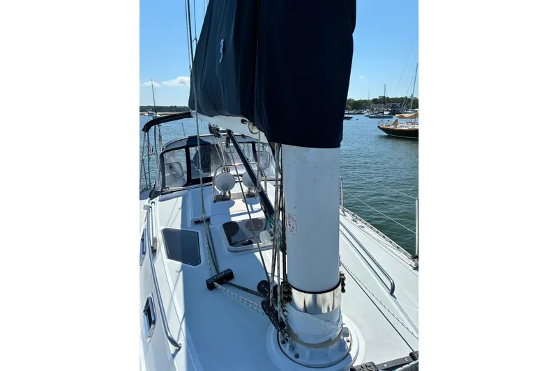 Slide: The Image of Sailboat deck view of 1996 Freedom 35, moored in a serene harbor. - 32