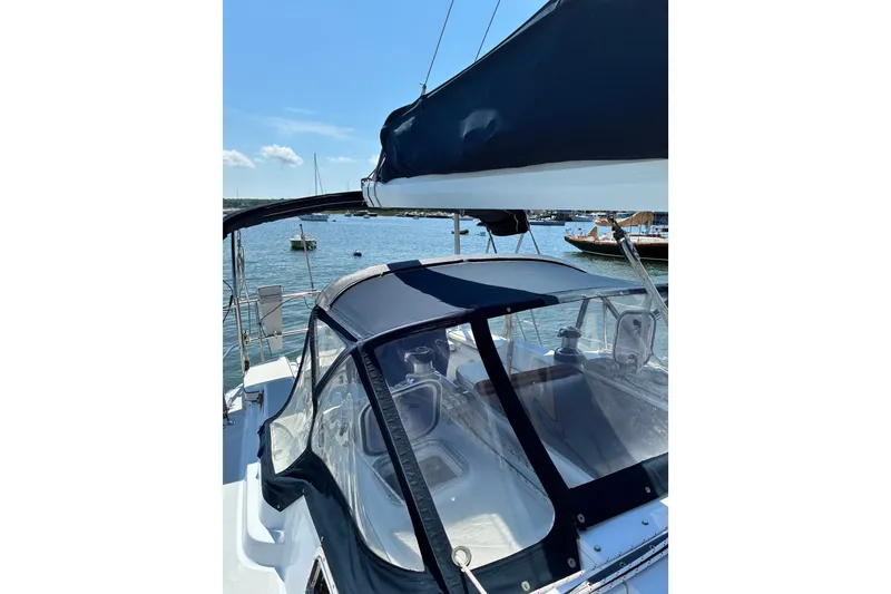 Slide: The Image of Sailboat Freedom 35, 1996 model, docked with clear canopy and blue skies. - 30