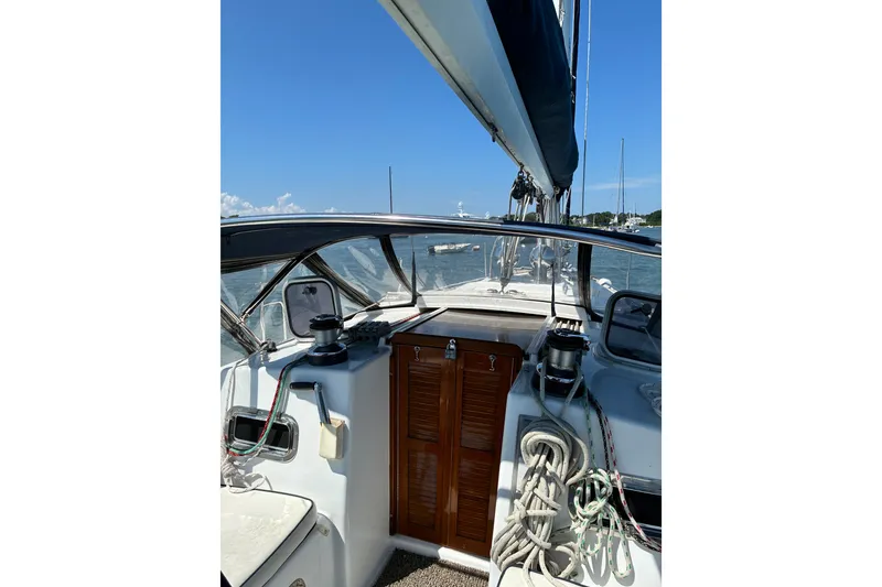 Slide: The Image of Sailboat cockpit view, Freedom 35, 1996 model, with ropes and clear sky. - 7