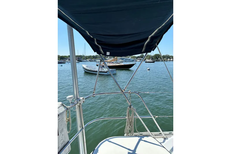 Slide: The Image of Sailboat view from Freedom 35, 1996 model, overlooking calm marina waters. - 23