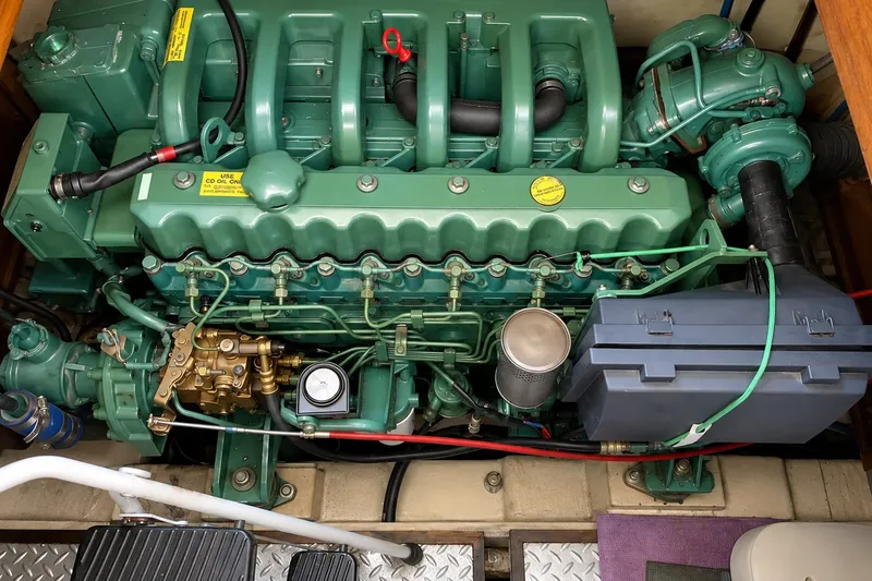 Slide: The Image of Engine of a 1986 Marine Trader Labelle boat, showcasing intricate mechanical components. - 30