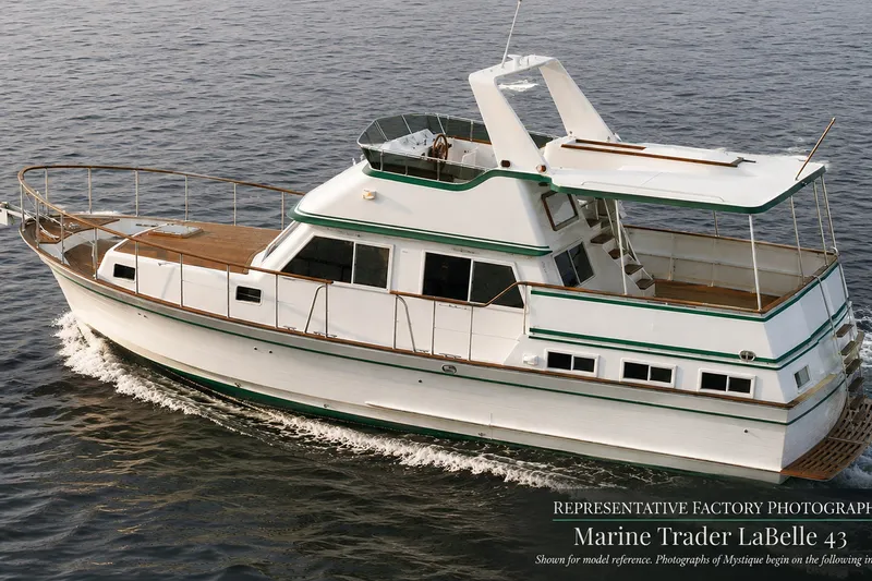 The Image of 1986 Marine Trader Labelle yacht cruising on open water, showcasing classic design and elegance. - 1