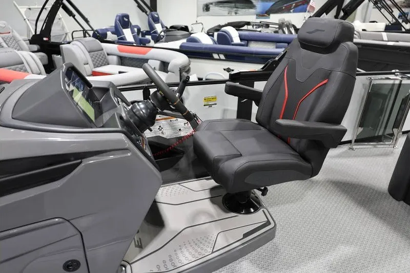 Slide: The Image of Captain's seat and helm of 2026 Evotti 723CS boat, featuring modern design and controls. - 11