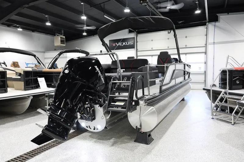 Slide: The Image of 2026 Evotti 723CS pontoon boat with Mercury engine in showroom. - 6