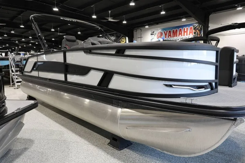 Slide: The Image of 2026 Evotti 723CS pontoon boat displayed indoors, featuring sleek design and modern aesthetics. - 2