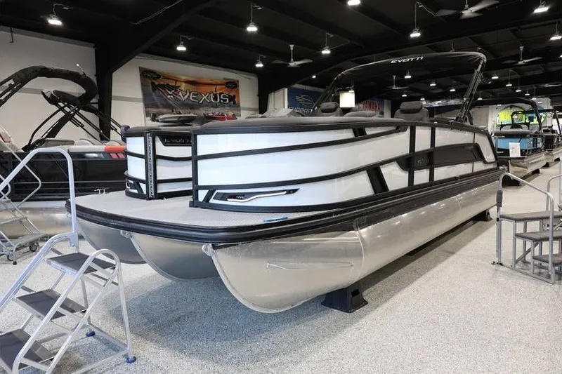 Slide: The Image of Evotti 723CS 2026 pontoon boat displayed in a showroom with sleek design. - 4