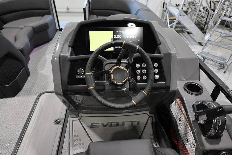 Slide: The Image of Cockpit of 2026 Evotti 723CS boat with modern steering and control panel. - 12