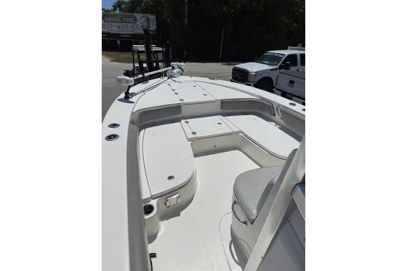 Slide: The Image of 2017 Robalo 246 Cayman boat interior with seating and storage compartments. - 12