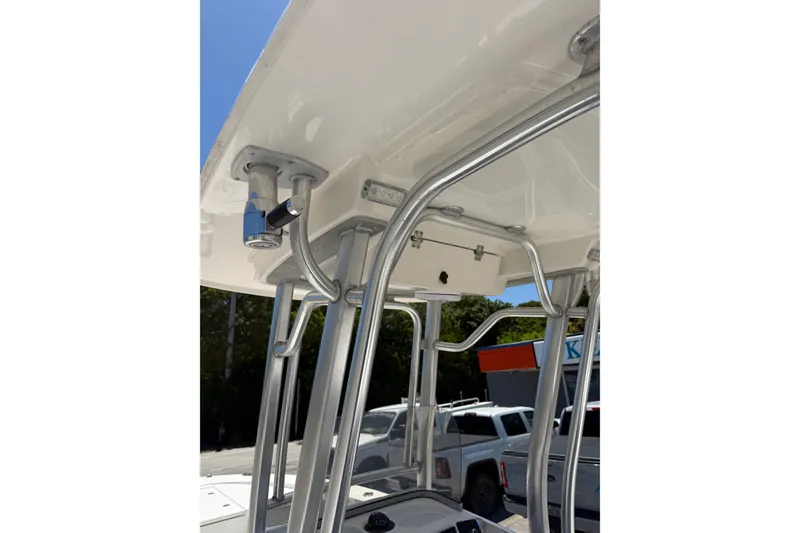 Slide: The Image of 2017 Robalo 246 Cayman boat T-top with stainless steel frame and mounted accessories. - 17