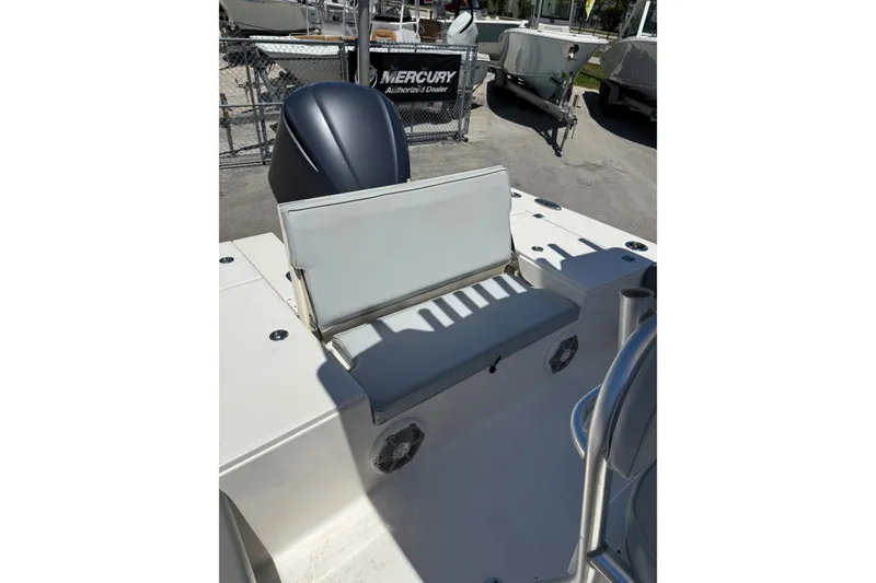 Slide: The Image of 2017 Robalo 246 Cayman boat interior with seating and engine view. - 14