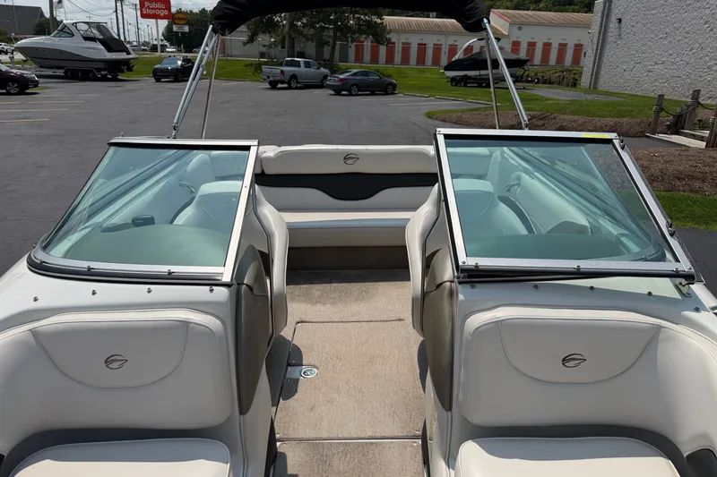 Slide: The Image of 2015 Crownline 21 SS boat interior with open windshield and seating. - 8