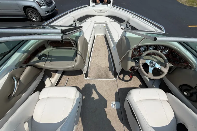 Slide: The Image of 2015 Crownline 21 SS boat interior with steering wheel and seating. - 11