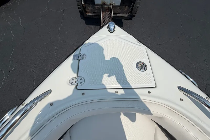 Slide: The Image of Bow view of 2015 Crownline 21 SS boat on pavement. - 3