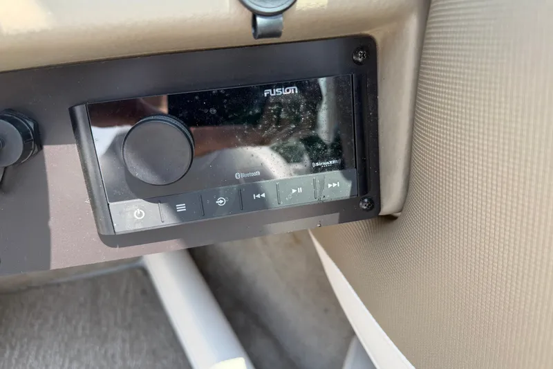 Slide: The Image of Fusion Bluetooth stereo system in a 2015 Crownline 21 SS boat dashboard. - 16
