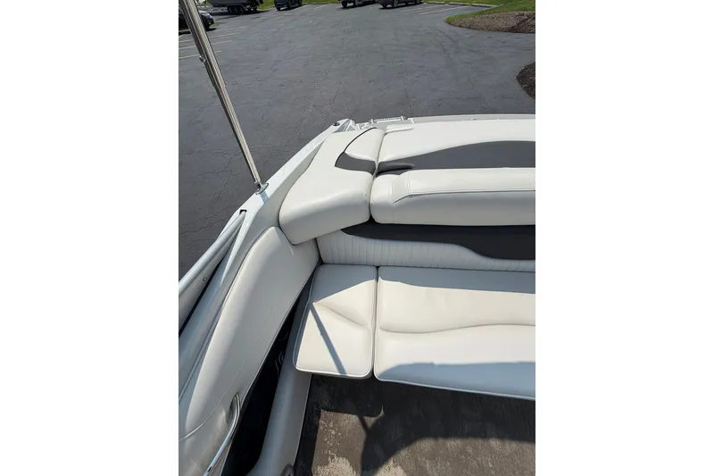 Slide: The Image of Interior view of a 2015 Crownline 21 SS boat with white seating. - 21