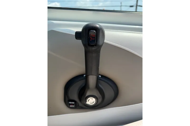 Slide: The Image of Throttle control lever of a 2015 Crownline 21 SS boat, close-up view. - 20