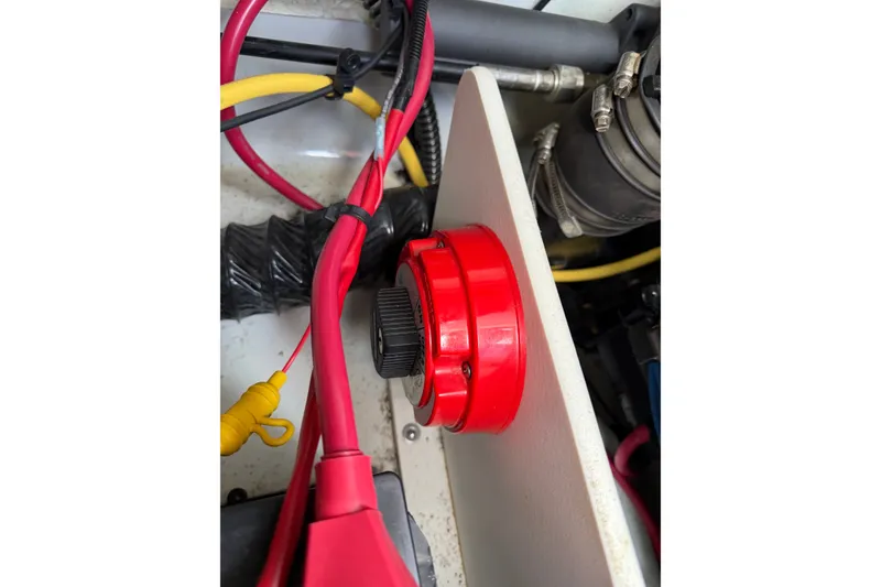 Slide: The Image of Engine compartment of 2015 Crownline 21 SS boat with red battery switch and wiring. - 7