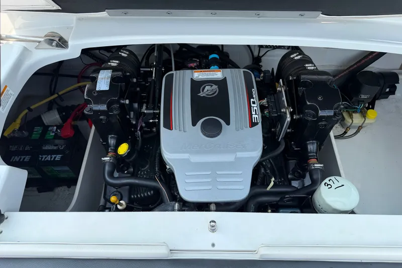 Slide: The Image of Engine compartment of a 2015 Crownline 21 SS boat featuring a MerCruiser 350 MAG engine. - 15