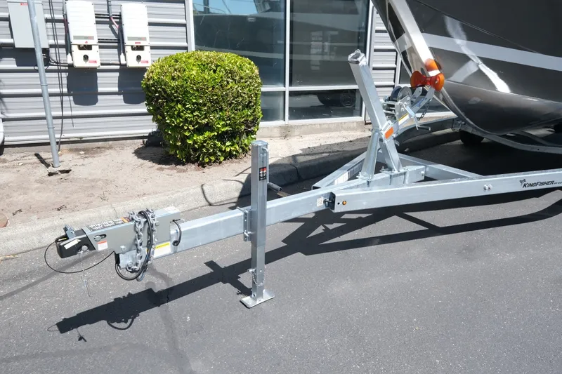 Slide: The Image of Trailer hitch of 2026 KingFisher 23 XAC boat parked on pavement. - 17