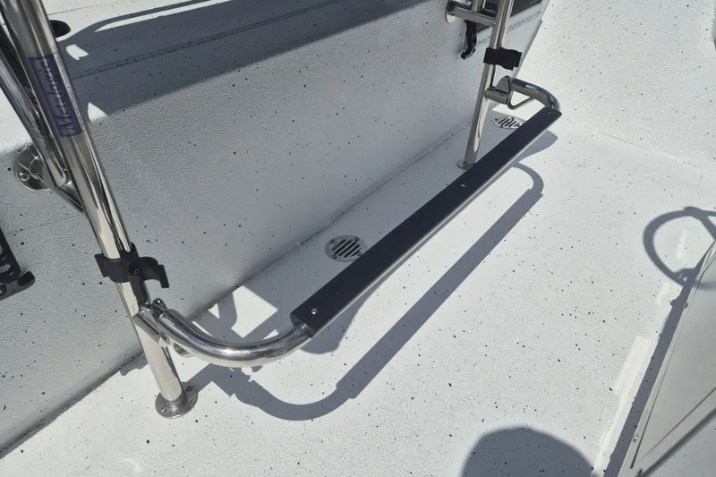 Slide: The Image of 2026 Xpress H22 Bay boat interior with stainless steel fittings and non-slip flooring. - 13