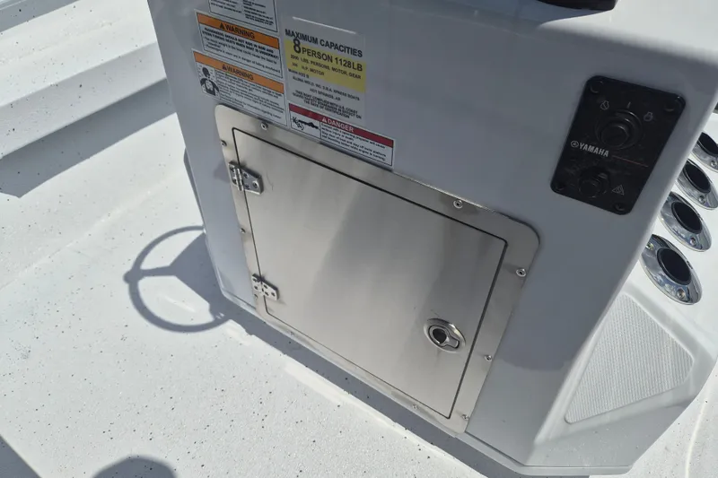 Slide: The Image of 2026 Xpress H22 Bay boat console with storage compartment and Yamaha controls. - 16