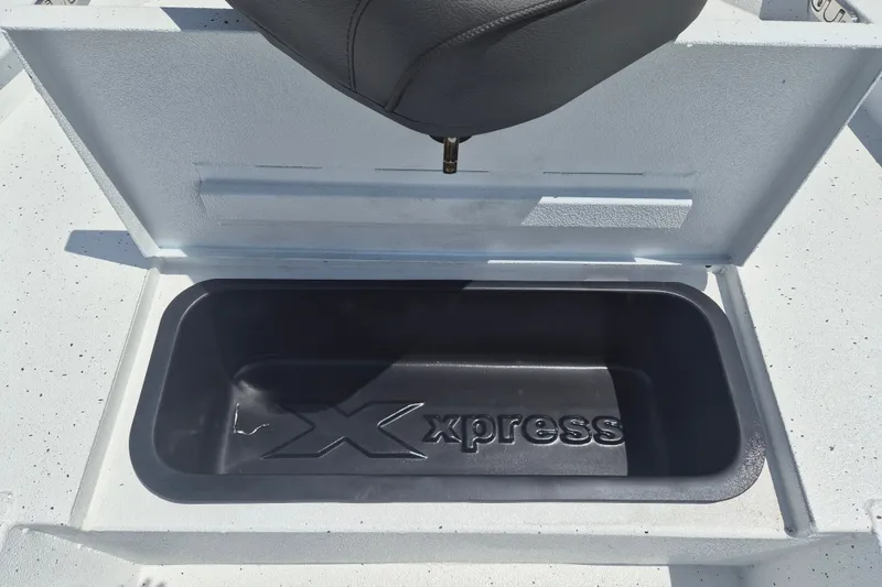 Slide: The Image of Storage compartment of 2026 Xpress H22 Bay boat with logo embossed inside. - 25
