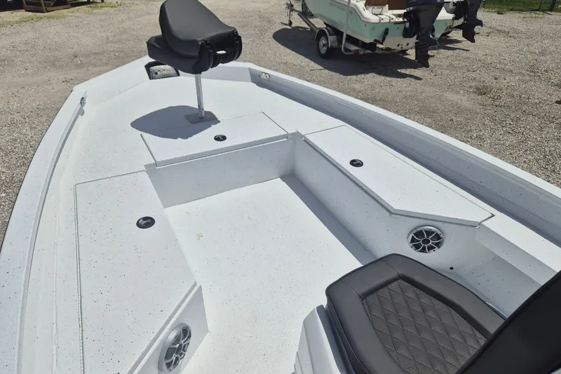 Slide: The Image of 2026 Xpress H22 Bay boat interior with seating and storage compartments. - 19