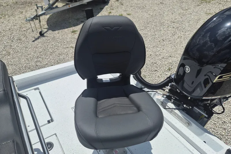 Slide: The Image of Black captain's chair on 2026 Xpress H22 Bay boat, next to a Yamaha outboard motor. - 8