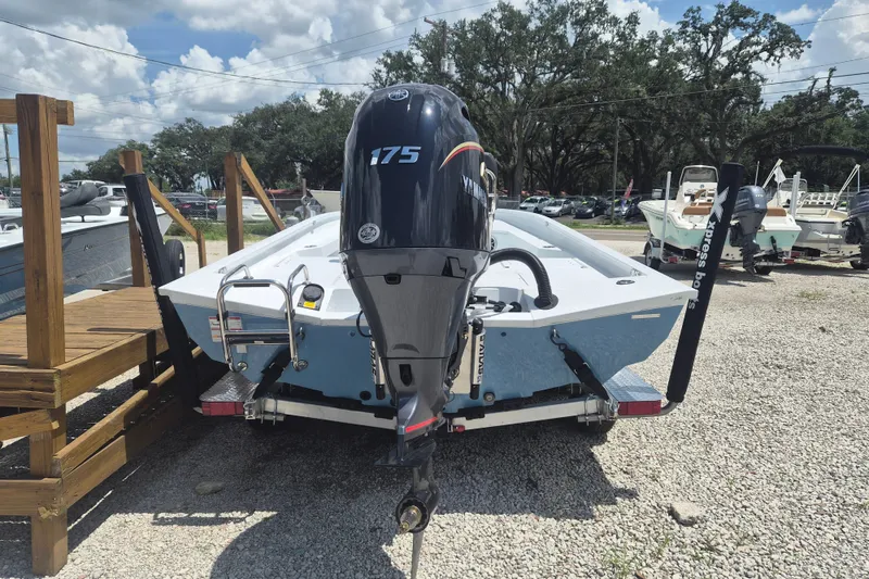 Slide: The Image of 2026 Xpress H22 Bay boat with Yamaha 175 engine on trailer, parked outdoors. - 3