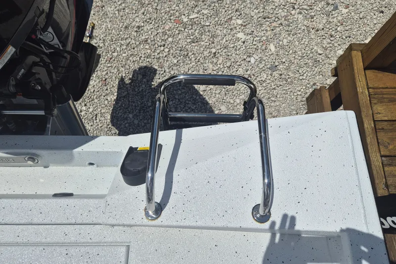 Slide: The Image of 2026 Xpress H22 Bay boat with chrome ladder on speckled white deck. - 6