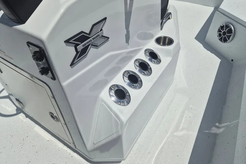 Slide: The Image of 2026 Xpress H22 Bay boat console with cup holders and speaker. - 18