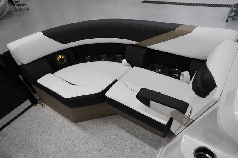 Slide: The Image of Luxurious seating on 2026 South Bay 224 RS Tritoon, featuring sleek black and white upholstery. - 23