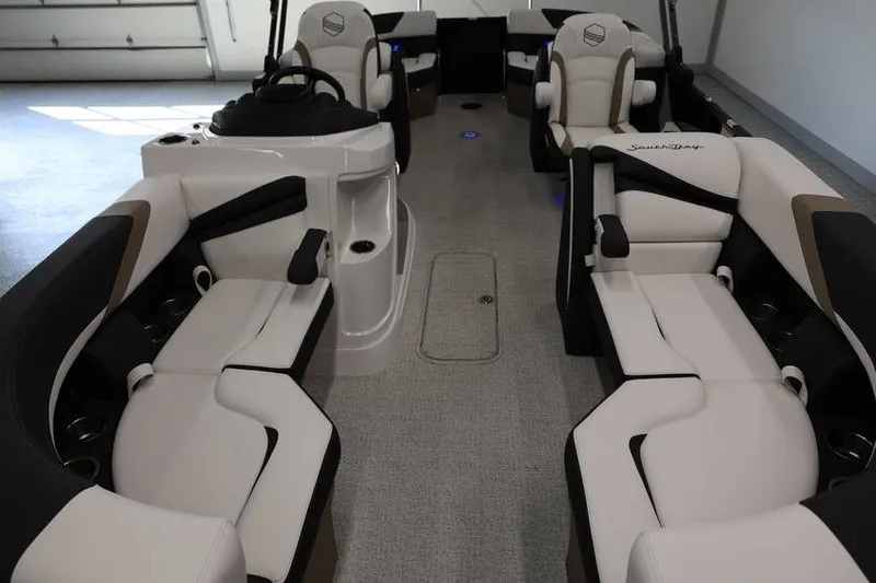 Slide: The Image of Interior of 2026 South Bay 224 RS Tritoon with luxurious seating and modern design. - 25