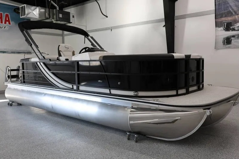 Slide: The Image of 2026 South Bay 224 RS Tritoon boat in showroom, sleek design, modern features. - 5
