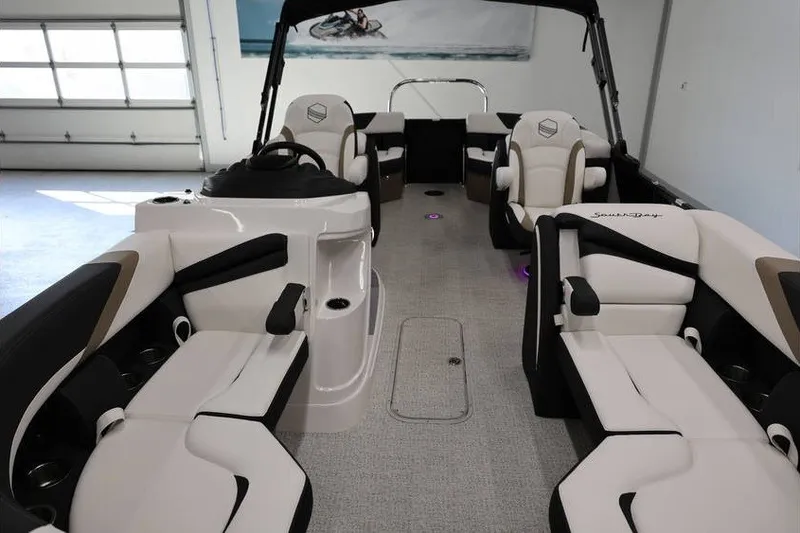 Slide: The Image of Interior of 2026 South Bay 224 RS Tritoon with luxurious seating and modern design. - 26