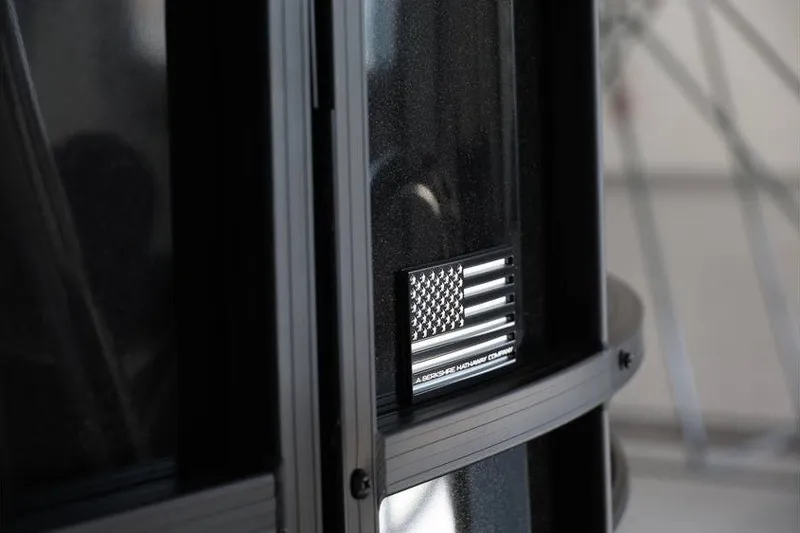 Slide: The Image of Close-up of a 2026 South Bay 224 RS Tritoon with American flag detail. - 11