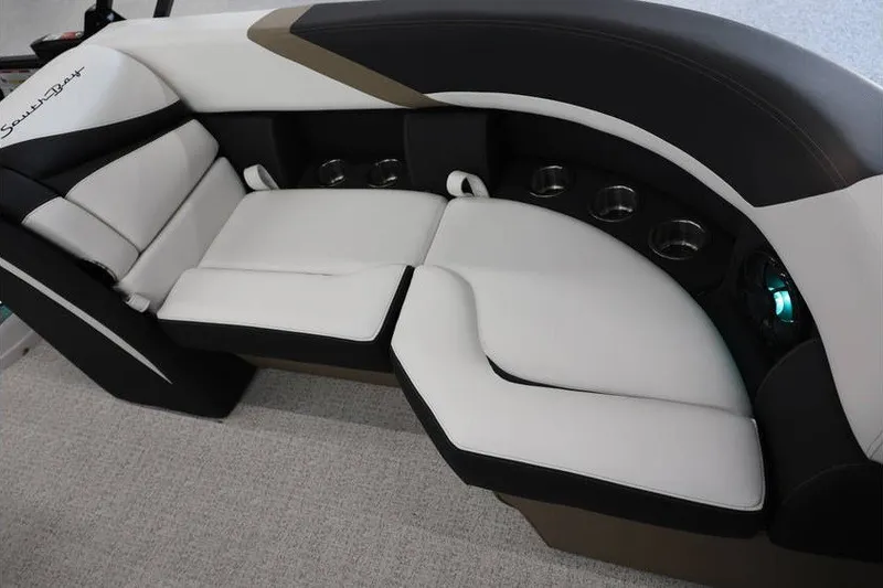Slide: The Image of Luxurious seating on 2026 South Bay 224 RS Tritoon boat, featuring sleek design and cup holders. - 14