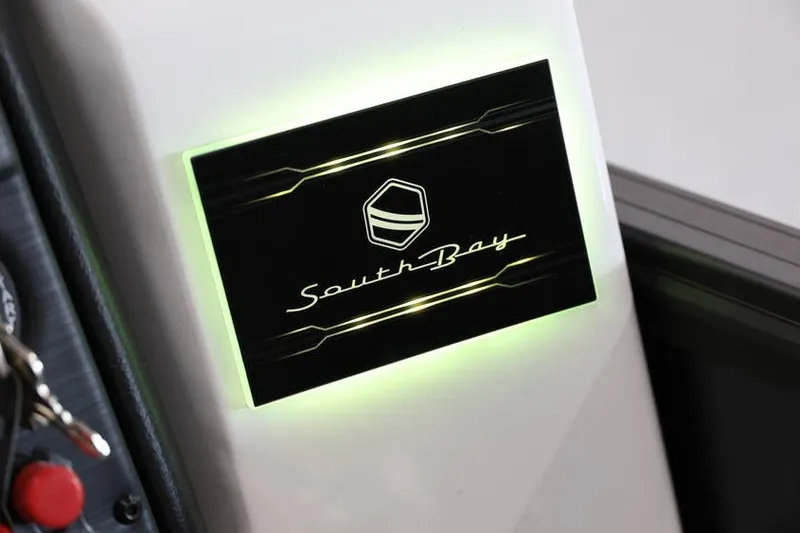 Slide: The Image of Illuminated South Bay logo on 2026 224 RS Tritoon boat dashboard. - 18