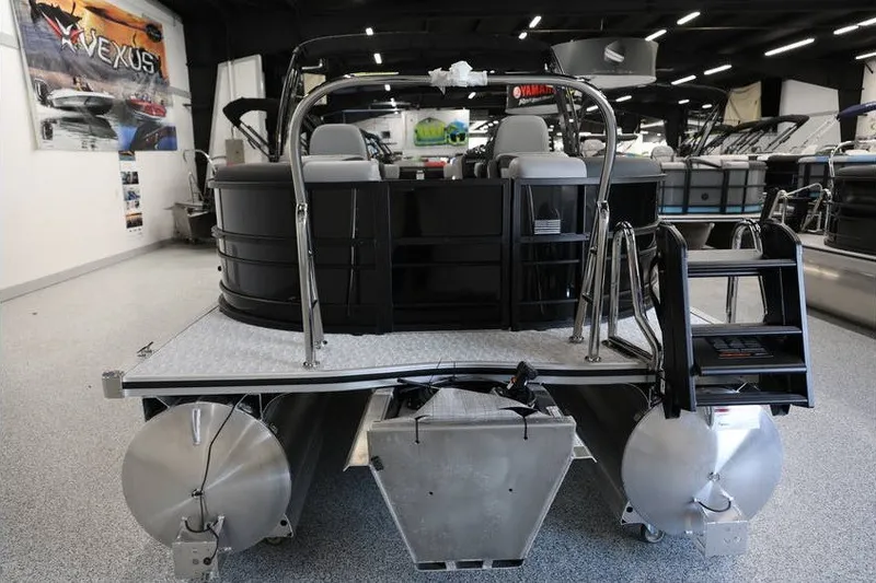 Slide: The Image of 2026 South Bay 224 RS 2.75 Hybrid Arch pontoon boat in showroom, rear view. - 7