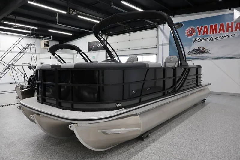 Slide: The Image of 2026 South Bay 224 RS 2.75 Hybrid Arch pontoon boat in showroom setting. - 4