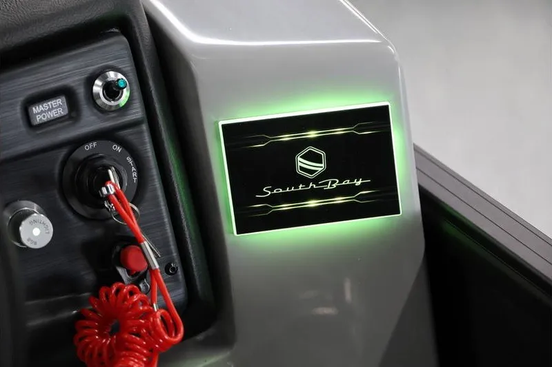 Slide: The Image of Control panel of 2026 South Bay 224 RS 2.75 Hybrid Arch boat, illuminated logo. - 11