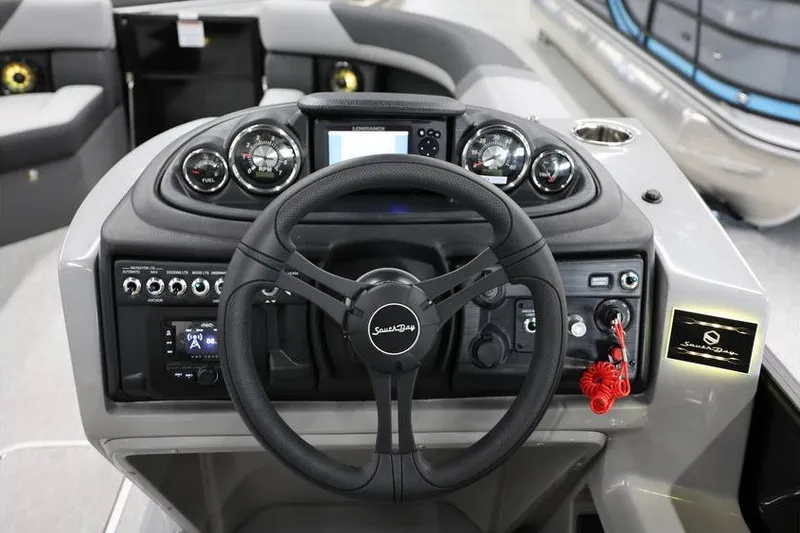 Slide: The Image of Steering console of 2026 South Bay 224 RS 2.75 Hybrid Arch boat, featuring modern controls. - 10