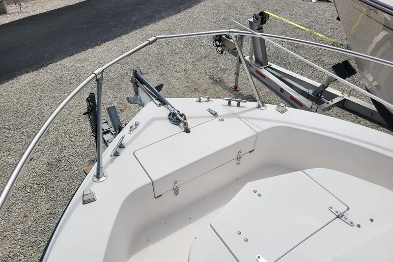 Slide: The Image of 1990 Grady-White Overnighter 204 boat bow with anchor and trailer. - 17