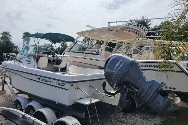 Slide: The Image of 1990 Grady-White Overnighter 204 boat with Yamaha outboard motor on trailer. - 4