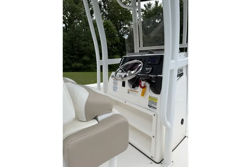 Slide: The Image of 2022 Robalo 226 Cayman boat console with steering wheel and controls. - 5