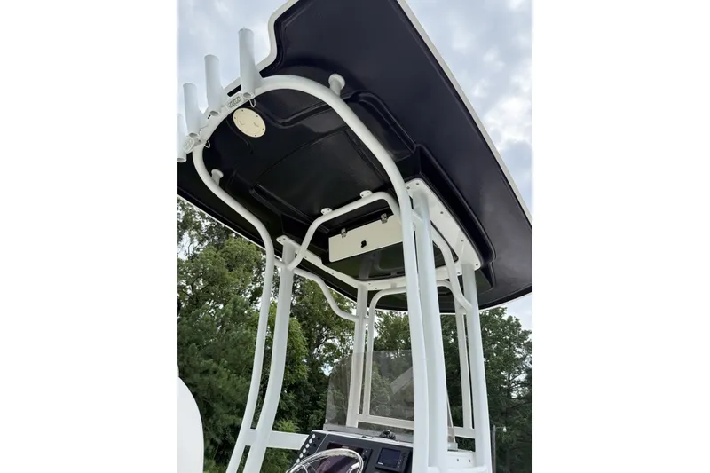Slide: The Image of T-top of 2022 Robalo 226 Cayman boat with rod holders and electronics box. - 6
