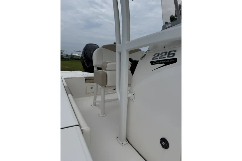 Slide: The Image of 2022 Robalo 226 Cayman boat interior with seating and console details. - 3