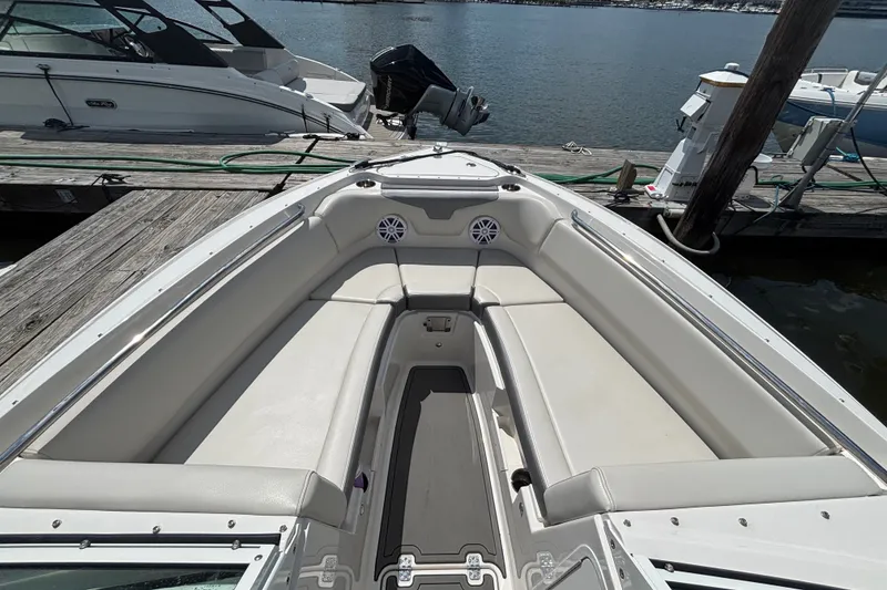 Slide: The Image of 2026 Sailfish 236 DC boat interior with spacious seating at dock. - 10