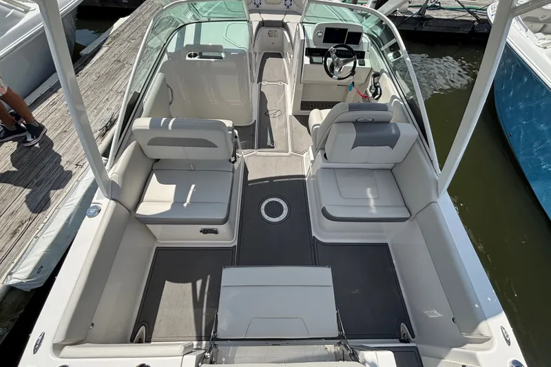 Slide: The Image of The image shows the cockpit of a Sailfish 236 DC boat with gray and white seating. - 3
