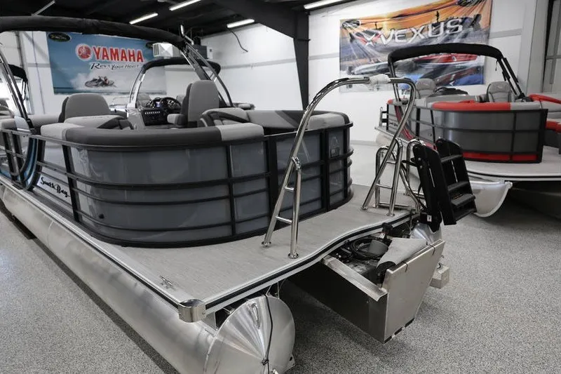 Slide: The Image of 2026 South Bay 224 RS 2.75 Hybrid Arch pontoon boat in showroom setting. - 4